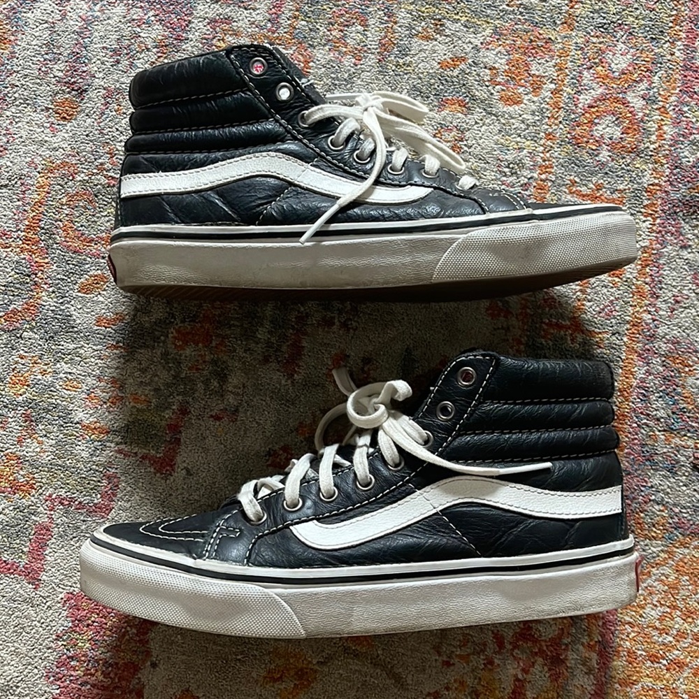 Vans black leather high tops woman’s size 7/mens size 5.5